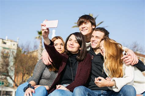 "Group Of Teen Friends Taking A Selfie With Their Phone Outside." by Stocksy Contributor ...