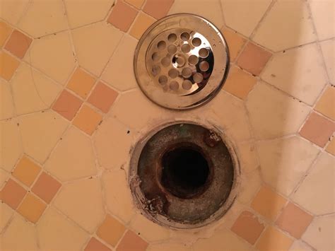 How to install a drain cover in the shower for this opening in the ...