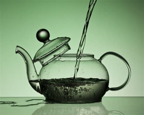 Pouring Water into a Teapot Stock Image - Image of motion, orange: 16932067