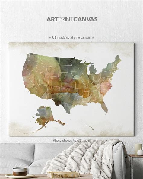 the map of the united states is displayed on a wall above a couch in a living room