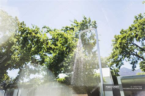 Running water from outdoor shower — motion, cosy - Stock Photo | #199377066