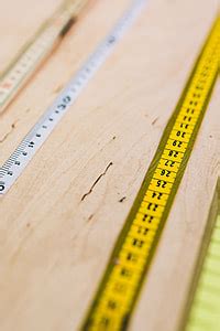 Royalty-Free photo: Close-ups of rulers on a wooden table | PickPik