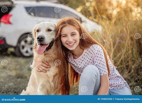 Portrait of Teenage Girl Petting Golden Retriever Stock Photo - Image of love, domestic: 194822350