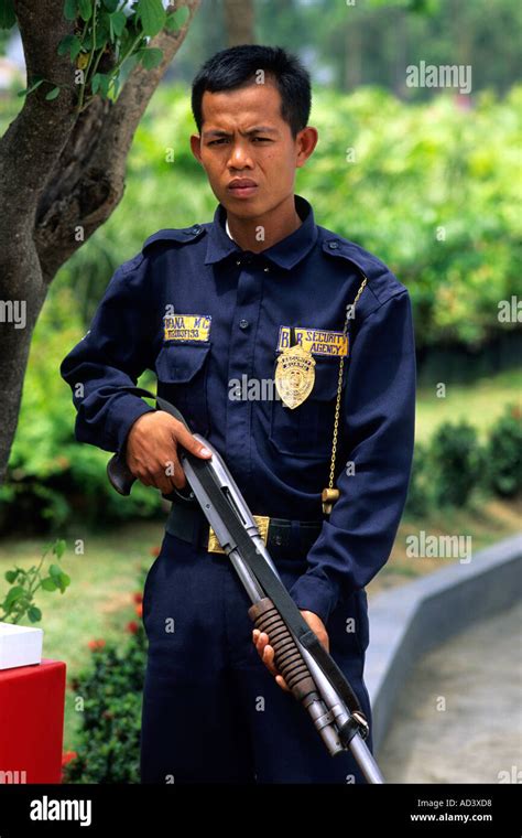 A security guard in the Philippines Stock Photo - Alamy