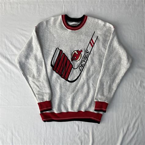 jersey devil hockey crew neck slight discoloration... - Depop