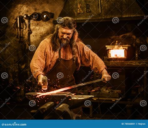 Senior Blacksmith Forging the Molten Metal on the Anvil in Smithy Stock Image - Image of ...