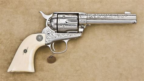 Colt factory engraved SAA revolver, 44-40 cal., 4-3/4” barrel, re-nickeled finish, Colt medallion iv