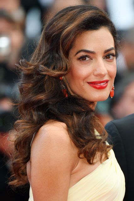 Amal Clooney Matching statement jewelry to makeup can be a dicey game, but Amal Clooney wins by ...