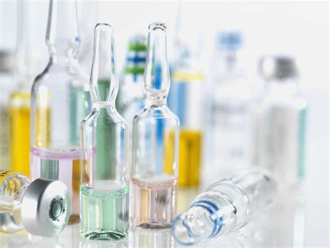 Selection of drugs including vials, ampules and vaccines illustrating medical research stock photo