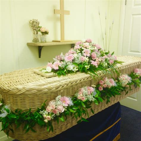 Willow Coffin with Flower Garland | Lodge Brothers - Funeral Directors