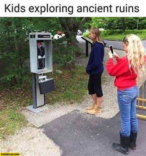 Kids exploring ancient ruins phone booth | StareCat.com