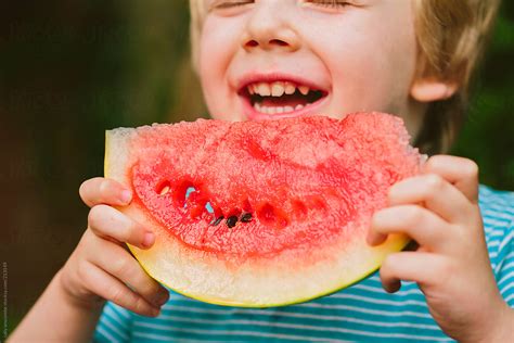 "Child Eating Watermelon" by Stocksy Contributor "Sally Anscombe" - Stocksy