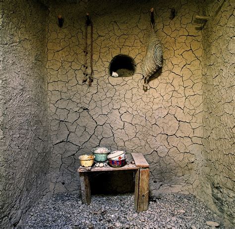 Interior of a mud-brick dwelling with artifacts 3 – Bait Muzna Gallery