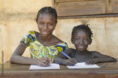 Two Beautiful African School Girls - Education for Africa Symbol Stock ...