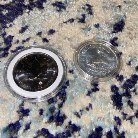 Two, 1 Troy ounce silver coins. One silver Canadian... - Depop