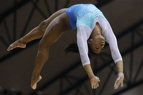 Biles hungry to keep edge as the world's top women's gymnast | AP News