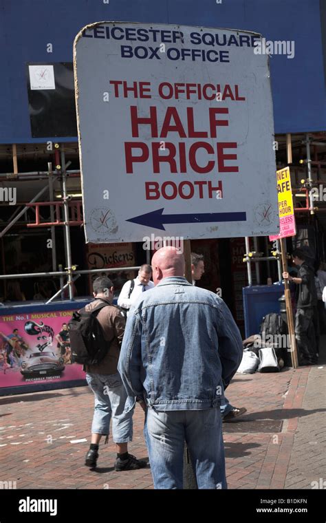 Half price West End theatre tickets sign held by man Stock Photo - Alamy