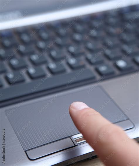 Using a built-in fingerprint recognition to unlock a laptop Stock Photo | Adobe Stock