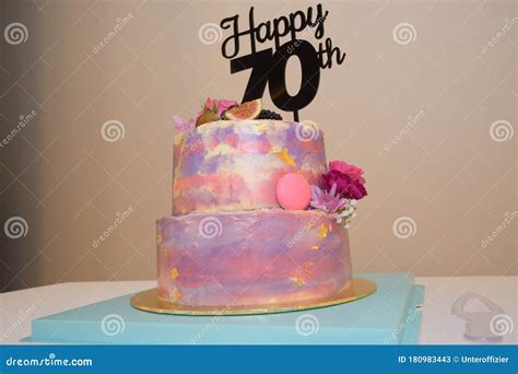 A Colorful Two Tiered Birthday Cake for a Seventy Year Old Birthday ...