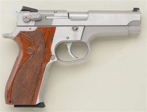 Smith & Wesson Model 5906 DA semi-auto pistol, 9mm cal., 4” barrel, stainless steel, checkered S&W