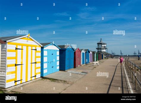 Colourful beach huts and The Harwich Low Lighthouse (Harwich Maritime ...