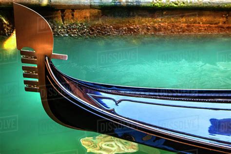 Close up of ornate gondola decoration on canal - Stock Photo - Dissolve