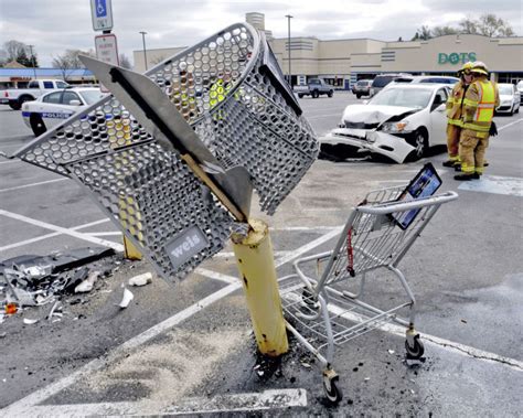 Car crashes into car, shopping cart and post in parking lot | News | lancasteronline.com