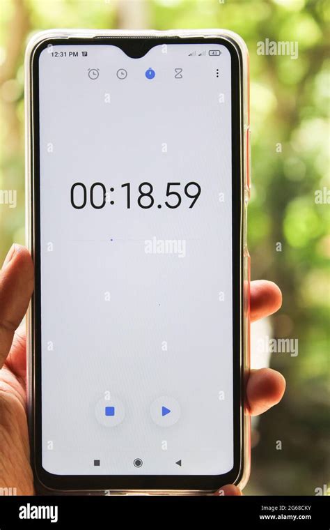 Timer alarm stopwatch clock concept,mobile stopwatch clock on hand ...