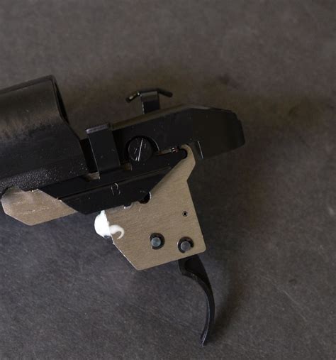 Howa 1500 barreled action review close up of trigger and bolt release – rifleshooter.com