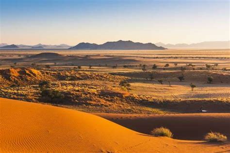 Namib desert at sunrise, Namibia - Marco Bottigelli/Getty Images | Namib desert, Northern lights ...