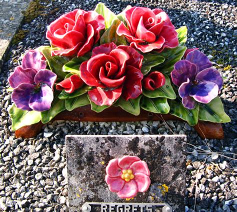 Ceramic flower arrangement and plaque at the cemetery | Flickr