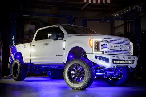 Fabtech Lifted F-250 Platinum on Fuel wheels wrapped with Nittos - Trinity Motorsports