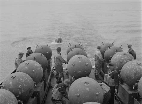 Laying sea mines aboard Finnish minelayer Ruotsinsalmi, 18 May 1942 ...