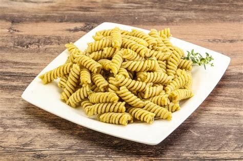 Premium Photo | Italian pasta fusilli with pesto