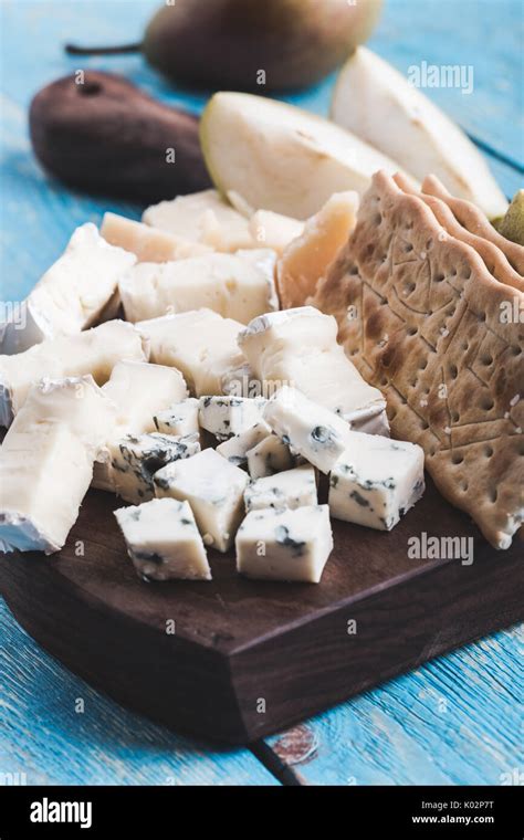 Cheese platter with blue cheese, soft cheese and aged cheese on rustic ...