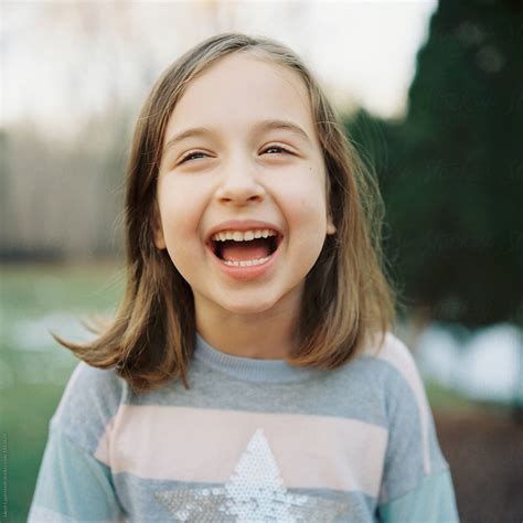 "Cute Young Girl Laughing" by Stocksy Contributor "Jakob Lagerstedt" - Stocksy