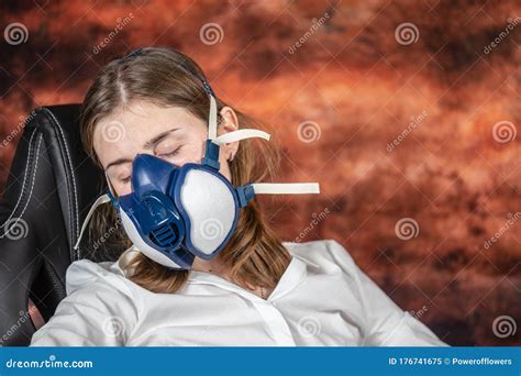 Woman in a Gas Mask Sleeping on a Chair. Coronovirus Quarantine, Stay Home, Work from Home ...