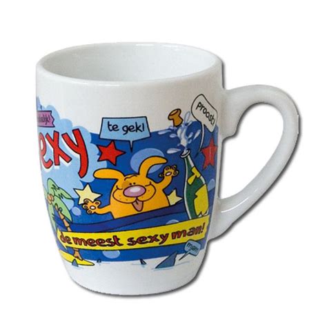 a white coffee cup with cartoon characters on it