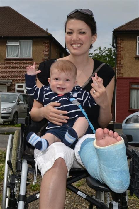 Mother with legcast in wheelchair