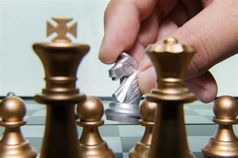 Premium Photo | Gold and silver chess on board