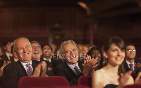 Theater audience laughing and clapping — Well Dressed, celebration ...