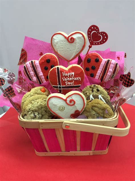 Delicious assortment of sugar cookies and gourmet cookies in an adorable Valentine Basket ...