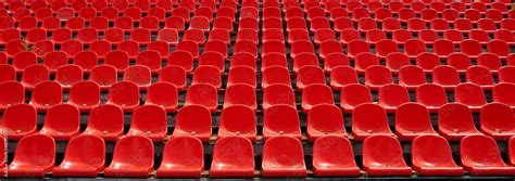 Rows of red football stadium seats with numbers. Stock Photo | Adobe Stock