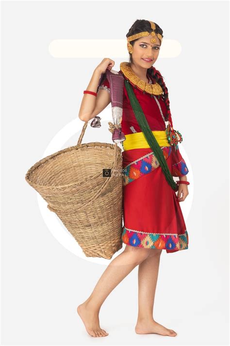 A traditional girl with cultural Bahun or Brahmin dress is carrying a doko - Photos Nepal