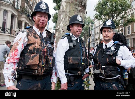 Police splashed with paint at Annual Notting Hill Carnival in London 2014 Stock Photo - Alamy