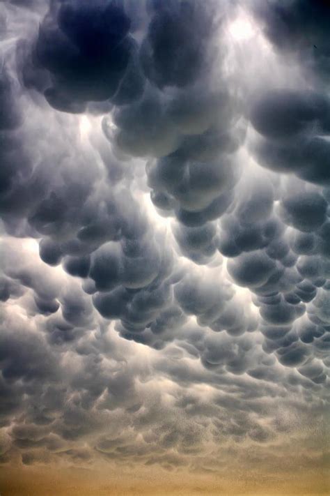 Mammatus Cloud Some day the origin of these clouds will be explained. They look artificial and ...