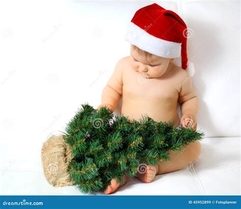 Baby with christmas tree stock image. Image of winter - 45952899