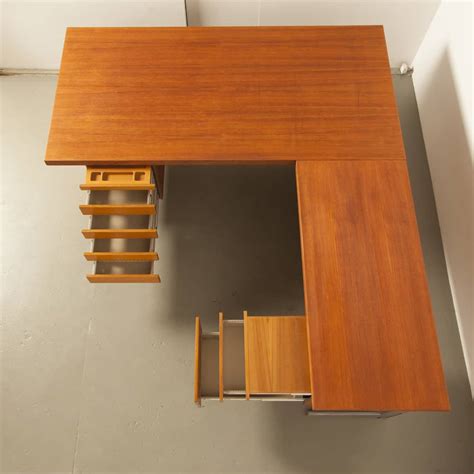 Floating L-shaped teak desk ⋆ Neef Louis Design Amsterdam