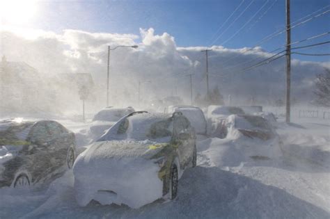 Winter storm turns New York into war zone as 9 more inches of snow on ...