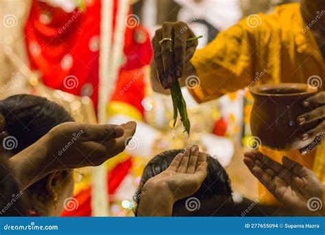 Hindu Puja Ritual Of Pushpanjali, Where The Priest Is Dripping Holy Water With Mango Leaves On ...